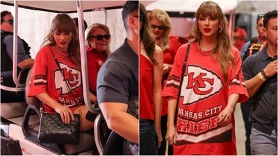Taylor Swift nails effortless style in an oversized red t-shirt, paired with chunky jewellery and a black handbag, exuding cool and casual vibes. (Instagram) Taylor Swift nails effortless style in an oversized red t-shirt, paired with chunky jewellery and a black handbag, exuding cool and casual vibes. (Instagram)