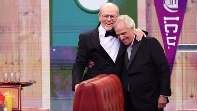 Presenters Ron Howard and Henry Winkler embrace in a set on stage at the 76th Primetime Emmy Awards. (REUTERS)