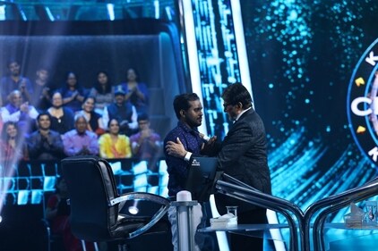 Amitabh Bachchan with KBC contestant Trishul. Amitabh Bachchan with KBC contestant Trishul.