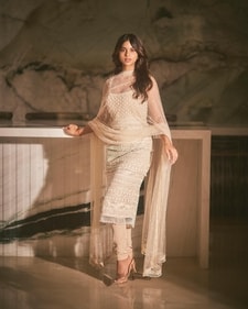 Actor Suhana Khan picked Falguni Shane Peacock’s ivory coloured cut sleeves kurta with matching churidars and a sheer dupatta Actor Suhana Khan picked Falguni Shane Peacock’s ivory coloured cut sleeves kurta with matching churidars and a sheer dupatta