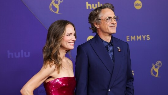 Susan Downey and Robert Downey Jr. poses for a Red Carpet portrait at the 76th Emmy Awards.(Danny Moloshok/Invision/AP)