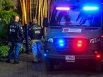 (FILES) Homeland Security Investigation agents are seen at the entrance of US producer and musician Sean "Diddy" Combs's home at Star Island in Miami Beach on March 25, 2024. Combs -- the rap mogul whose star has plunged after a wave of sex trafficking and assault lawsuits against him -- was arrested in Manhattan late on September 16, 2024, multiple US news outlets reported. The 54-year-old's arrest follows a grand jury indictment and the charges are not immediately clear, The New York Times said, citing a person familiar with the indictment. (Photo by GIORGIO VIERA / AFP)