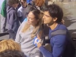 Neeraj Chopra poses for a photo with a fan