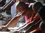 Hindu pilgrims from Kolkata perform ‘pind-daan’ rituals for the salvation of their ancestors on the second day of Pitru Paksha in Allahabad, Uttar Pradesh. (Sanjay Kanojia / AFP)