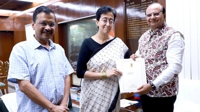 Former Delhi chief minister Arvind Kejriwal, CM-designate Atishi and Delhi lieutenant governor VK Saxena. Former Delhi chief minister Arvind Kejriwal, CM-designate Atishi and Delhi lieutenant governor VK Saxena.
