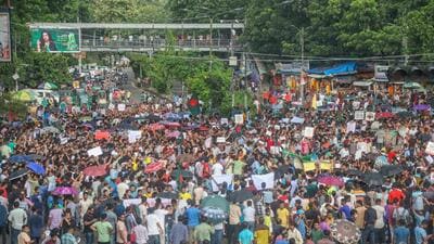 Bangladesh Hindu community members participate in a protest and block the Shahbagh intersection in Dhaka, Bangladesh, on August 10. (PTI) Bangladesh Hindu community members participate in a protest and block the Shahbagh intersection in Dhaka, Bangladesh, on August 10. (PTI)