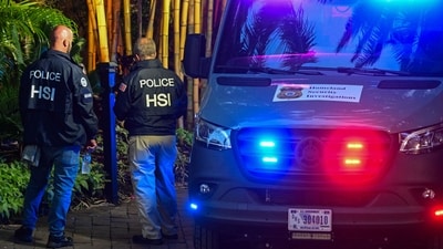 (FILES) Homeland Security Investigation agents are seen at the entrance of US producer and musician Sean "Diddy" Combs's home at Star Island in Miami Beach on March 25, 2024. Combs -- the rap mogul whose star has plunged after a wave of sex trafficking and assault lawsuits against him -- was arrested in Manhattan late on September 16, 2024, multiple US news outlets reported. The 54-year-old's arrest follows a grand jury indictment and the charges are not immediately clear, The New York Times said, citing a person familiar with the indictment. (Photo by GIORGIO VIERA / AFP) (AFP) (FILES) Homeland Security Investigation agents are seen at the entrance of US producer and musician Sean "Diddy" Combs's home at Star Island in Miami Beach on March 25, 2024. Combs -- the rap mogul whose star has plunged after a wave of sex trafficking and assault lawsuits against him -- was arrested in Manhattan late on September 16, 2024, multiple US news outlets reported. The 54-year-old's arrest follows a grand jury indictment and the charges are not immediately clear, The New York Times said, citing a person familiar with the indictment. (Photo by GIORGIO VIERA / AFP) (AFP)