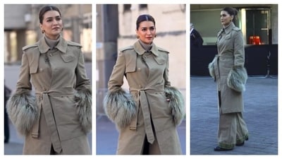 Kriti Sanon wore a trench coat with luxurious faux fur at the sleeves with a waist-cinching belt. Underneath the trench coat, she wore a matching turtle neck. Her trousers played along with her monochrome look and matched the trench coat. Her hair was parted in the middle and styled into a sleek bun. She accessorised with chunky golden hoops. Kriti Sanon wore a trench coat with luxurious faux fur at the sleeves with a waist-cinching belt. Underneath the trench coat, she wore a matching turtle neck. Her trousers played along with her monochrome look and matched the trench coat. Her hair was parted in the middle and styled into a sleek bun. She accessorised with chunky golden hoops. 