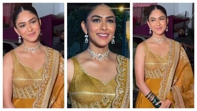 Mrunal Thakur's ethnic wear dazzled in a gilded affair. Donned in a golden ethnic outfit, her sweetheart neckline was further beautified by the glam choker neckpiece. Her bust area and dupatta featured fine mirrorwork and delicate threadwork. She accessorised her outfit with green bangles and earrings to match her necklace. Mrunal Thakur's ethnic wear dazzled in a gilded affair. Donned in a golden ethnic outfit, her sweetheart neckline was further beautified by the glam choker neckpiece. Her bust area and dupatta featured fine mirrorwork and delicate threadwork. She accessorised her outfit with green bangles and earrings to match her necklace. 