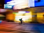 A Chinese delivery driver who had 18-hour workdays died while resting on his bike. 