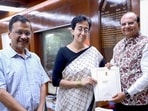 Delhi chief minister Arvind Kejriwal and AAP leader Atishi with Delhi LG VK Saxena at the LG House. Arvind Kejriwal resigned as Delhi chief minister, while Atishi stakes a claim to the position, on Tuesday. (HT Photo)