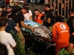 A person is carried on a stretcher outside American University of Beirut Medical Center (AUBMC) as people, including Hezbollah fighters and medics, were wounded and killed when the pagers they use to communicate exploded across Lebanon, according to a security source, in Beirut, Lebanon. 