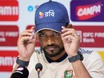 Bangladesh captain Najmul Hossain Shanto gestures while speaking at a press conference ahead of the first cricket Test match.