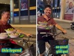 The image shows a man navigating a busy road on a bicycle while balancing a tray filled with soup bowls. The image shows a man navigating a busy road on a bicycle while balancing a tray filled with soup bowls.
