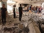 People check debris after a school used as shelter by displaced Palestinians was hit by an Israeli strike in the Shujaiya neighbourhood of Gaza City on September 18, 2024, amid the ongoing war between Israel and the militant group Hamas. (Photo by Omar AL-QATTAA / AFP) People check debris after a school used as shelter by displaced Palestinians was hit by an Israeli strike in the Shujaiya neighbourhood of Gaza City on September 18, 2024, amid the ongoing war between Israel and the militant group Hamas. (Photo by Omar AL-QATTAA / AFP)