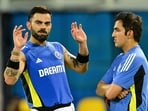 India's Virat Kohli talks with head coach Gautam Gambhir (R) during a practice session.