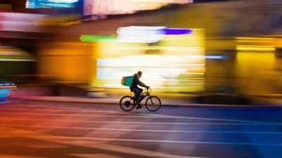A Chinese delivery driver who had 18-hour workdays died while resting on his bike. (Unsplash/paoloficasso)