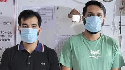 Cousins Akshay Sehgal (33), a resident of Delhi, and Vaibhav Sehgal (27), a resident of Noida, in police custody. (HT Photo) Cousins Akshay Sehgal (33), a resident of Delhi, and Vaibhav Sehgal (27), a resident of Noida, in police custody. (HT Photo)