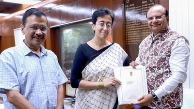 Delhi chief minister Arvind Kejriwal and AAP leader Atishi with Delhi LG VK Saxena at the LG House. Arvind Kejriwal resigned as Delhi chief minister, while Atishi stakes a claim to the position, on Tuesday. (HT Photo) (HT_PRINT) Delhi chief minister Arvind Kejriwal and AAP leader Atishi with Delhi LG VK Saxena at the LG House. Arvind Kejriwal resigned as Delhi chief minister, while Atishi stakes a claim to the position, on Tuesday. (HT Photo) (HT_PRINT)