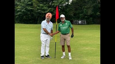Golfer Gurpreet Singh (left) after hitting a stunning hole-in-one on the par-3 8th hole at the Chandigarh Golf Club on Wednesday. (HT Photo) Golfer Gurpreet Singh (left) after hitting a stunning hole-in-one on the par-3 8th hole at the Chandigarh Golf Club on Wednesday. (HT Photo)