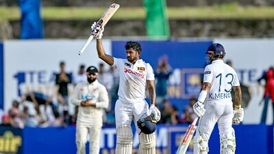 Kamindu Mendis (C) celebrates with Kusal Mendis after scoring a century during the first day of the first Test cricket match between Sri Lanka and New Zealand. (AFP) Kamindu Mendis (C) celebrates with Kusal Mendis after scoring a century during the first day of the first Test cricket match between Sri Lanka and New Zealand. (AFP)