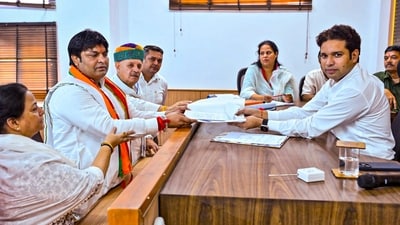 BJP candidate Mukesh Sharma files his nomination papers in the presence of party leader Rao Inderjit Singh for the Haryana Assembly elections, in Gurugram. (PTI) BJP candidate Mukesh Sharma files his nomination papers in the presence of party leader Rao Inderjit Singh for the Haryana Assembly elections, in Gurugram. (PTI)