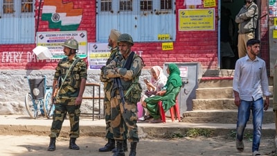 Security personnel are stationed at a polling booth in Anantnag district to ensure safety during the first phase of the Jammu and Kashmir Assembly elections. (PTI) Security personnel are stationed at a polling booth in Anantnag district to ensure safety during the first phase of the Jammu and Kashmir Assembly elections. (PTI)