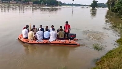 Officials inspect the flood situation on a speed boat before it overturned in the Kuai river, in Birbhum district of West Bengal. (PTI Photo) (PTI) Officials inspect the flood situation on a speed boat before it overturned in the Kuai river, in Birbhum district of West Bengal. (PTI Photo) (PTI)