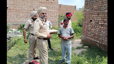Policemen at the crime spot in Jogi Nagar of Bathinda on Wednesday. (Sanjeev Kumar / HT)