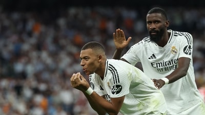 Real Madrid's French forward #09 Kylian Mbappe celebrates with Real Madrid's German defender #22 Antonio Ruediger after scoring his team's first goal during the UEFA Champions League 1st round day 1 football match between Real Madrid CF and Stuttgart VFB (AFP) Real Madrid's French forward #09 Kylian Mbappe celebrates with Real Madrid's German defender #22 Antonio Ruediger after scoring his team's first goal during the UEFA Champions League 1st round day 1 football match between Real Madrid CF and Stuttgart VFB (AFP)