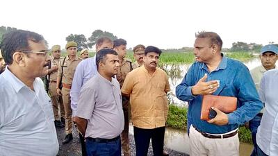To be sure, the downpour inundated Ranhera and adjoining areas including Bankapur, where water was accumulated in streets and homes, making residents’ movement a challenge, disrupting normal life. (HT Photo) To be sure, the downpour inundated Ranhera and adjoining areas including Bankapur, where water was accumulated in streets and homes, making residents’ movement a challenge, disrupting normal life. (HT Photo)