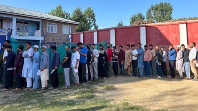Voters line up outside a polling station in Kulgam in the Union Territory of Jammu and Kashmir during phase 1 assembly election. By 5 pm, the overall voter turnout was 58.19%. (Waseem Andrabi/HT Photo) Voters line up outside a polling station in Kulgam in the Union Territory of Jammu and Kashmir during phase 1 assembly election. By 5 pm, the overall voter turnout was 58.19%. (Waseem Andrabi/HT Photo)