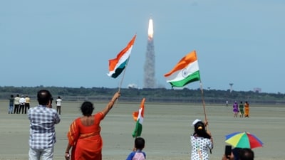 People wave the national flag as they celebrate the launch of Chandrayaan-3 mission from the Satish Dhawan Space Centre, in Sriharikota on Friday. (ANI) People wave the national flag as they celebrate the launch of Chandrayaan-3 mission from the Satish Dhawan Space Centre, in Sriharikota on Friday. (ANI)