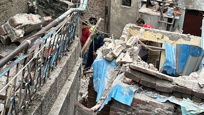 A portion of a house collapsed in New Delhi's Karol Bagh area on Wednesday. (ANI)