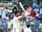 India's Ravichandran Ashwin celebrates after scoring a century. India's Ravichandran Ashwin celebrates after scoring a century.