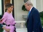 Former President Donald Trump, right, stands with Melania Trump as they arrive for a GOP fundraiser, Saturday, April 6, 2024, in Palm Beach, Fla. (AP Photo/Lynne Sladky)