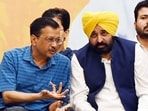 Delhi chief minister Arvind Kejriwal with Punjab CM Bhagwant Mann, during the programme on Sunday.