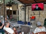 Men smoke waterpipes as they attend a televised speech by the leader of the Lebanese Shiite movement Hezbollah Hassan Nasrallah at a cafe in the Jabal Mehsen neighbourhood of Lebanon's northern city of Tripoli. (Photo by Fathi AL-MASRI / AFP) Men smoke waterpipes as they attend a televised speech by the leader of the Lebanese Shiite movement Hezbollah Hassan Nasrallah at a cafe in the Jabal Mehsen neighbourhood of Lebanon's northern city of Tripoli. (Photo by Fathi AL-MASRI / AFP)