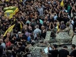 Lebanese army soldiers sit on their armoured vehicle as mourners carry the coffin of Mohammed Mahdi, son of Hezbollah legislator Ali Ammar, who was killed Tuesday after his handheld pager exploded. Lebanese army soldiers sit on their armoured vehicle as mourners carry the coffin of Mohammed Mahdi, son of Hezbollah legislator Ali Ammar, who was killed Tuesday after his handheld pager exploded.