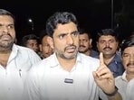 TDP leader Nara Lokesh Tirupati laddu in Tirupati, Andhra Pradesh on Thursday. (PTI) TDP leader Nara Lokesh Tirupati laddu in Tirupati, Andhra Pradesh on Thursday. (PTI)