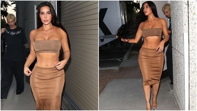 Kim Kardashian is known for her daring and bold style, and her latest look is no exception. She rocks a brown tube top paired with a matching bodycon skirt featuring a knee-length hemline, extremely long tresses, and a nude lipstick, serving major fashion goals. (Instagram) Kim Kardashian is known for her daring and bold style, and her latest look is no exception. She rocks a brown tube top paired with a matching bodycon skirt featuring a knee-length hemline, extremely long tresses, and a nude lipstick, serving major fashion goals. (Instagram)