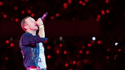 Singer Chris Martin of British rock band Coldplay performs on stage during a concert at the Ernst Happel Stadium in Vienna, Austria on August 21, 2024. Security measures have been tightened in Vienna for a series of concerts by British band Coldplay this week, Austrian police said on August 20, 2024, after Taylor Swift's shows were cancelled after a suicide bombing plot. (Photo by TOBIAS STEINMAURER / APA / AFP) / Austria OUT / RESTRICTED TO EDITORIAL USE - MANDATORY MENTION OF THE ARTIST UPON PUBLICATION - TO ILLUSTRATE THE EVENT AS SPECIFIED IN THE CAPTION - NO MARKETING NO ADVERTISING CAMPAIGNS - DISTRIBUTED AS A SERVICE TO CLIENTS - NO ARCHIVE / SOUTH TYROL OUT (AFP) Singer Chris Martin of British rock band Coldplay performs on stage during a concert at the Ernst Happel Stadium in Vienna, Austria on August 21, 2024. Security measures have been tightened in Vienna for a series of concerts by British band Coldplay this week, Austrian police said on August 20, 2024, after Taylor Swift's shows were cancelled after a suicide bombing plot. (Photo by TOBIAS STEINMAURER / APA / AFP) / Austria OUT / RESTRICTED TO EDITORIAL USE - MANDATORY MENTION OF THE ARTIST UPON PUBLICATION - TO ILLUSTRATE THE EVENT AS SPECIFIED IN THE CAPTION - NO MARKETING NO ADVERTISING CAMPAIGNS - DISTRIBUTED AS A SERVICE TO CLIENTS - NO ARCHIVE / SOUTH TYROL OUT (AFP)