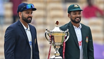 India's captain Rohit Sharma (L) and his Bangladesh's counterpart Najmul Hossain Shanto pose with the trophy before the start of the first day play of the first Test (AFP) India's captain Rohit Sharma (L) and his Bangladesh's counterpart Najmul Hossain Shanto pose with the trophy before the start of the first day play of the first Test (AFP)