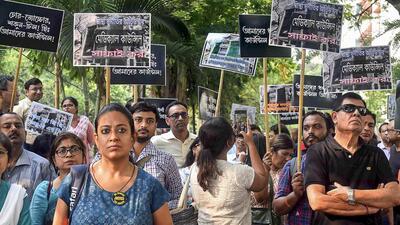 Doctors stage a protest in front of West Bengal Medical Council office over the R G Kar Hospital incident, in Kolkata, on Sept 19. (PTI)