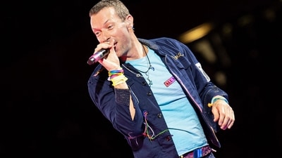 Singer Chris Martin of British rock band Coldplay. The group is reportedly coming to India in 2025. (AFP) Singer Chris Martin of British rock band Coldplay. The group is reportedly coming to India in 2025. (AFP)