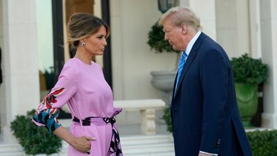 Former President Donald Trump, right, stands with Melania Trump as they arrive for a GOP fundraiser, Saturday, April 6, 2024, in Palm Beach, Fla. (AP Photo/Lynne Sladky) (AP)