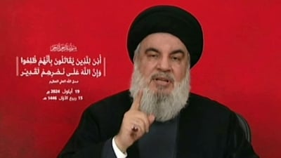 An image grab taken from Hezbollah's Al-Manar TV shows the Lebanese militant group's chief Hassan Nasrallah addressing the nation from an undisclosed location on September 19, 2024. (AFP)