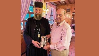 Navin Chawla presents his biography of Mother Teresa to Archbishop Kocsis Fülöp