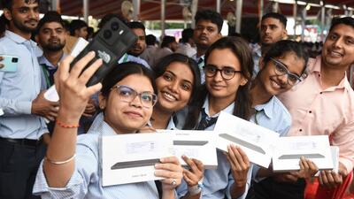 Students pose with tablets distributed by Uttar Pradesh chief minister Yogi Adityanath at the event in Ghanta Ghar Ramlila Maidan in Ghaziabad on Wednesday. (Sakib Ali/HT Photo) Students pose with tablets distributed by Uttar Pradesh chief minister Yogi Adityanath at the event in Ghanta Ghar Ramlila Maidan in Ghaziabad on Wednesday. (Sakib Ali/HT Photo)