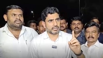 TDP leader Nara Lokesh Tirupati laddu in Tirupati, Andhra Pradesh on Thursday. (PTI) TDP leader Nara Lokesh Tirupati laddu in Tirupati, Andhra Pradesh on Thursday. (PTI)